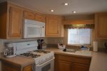 Fully furnished kitchen has ample sleeping space